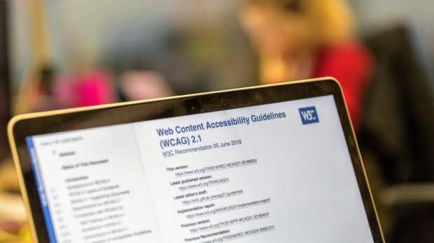 A laptop open to a webpage title 'Web Content Accessibility Services (WCAG) 2.1